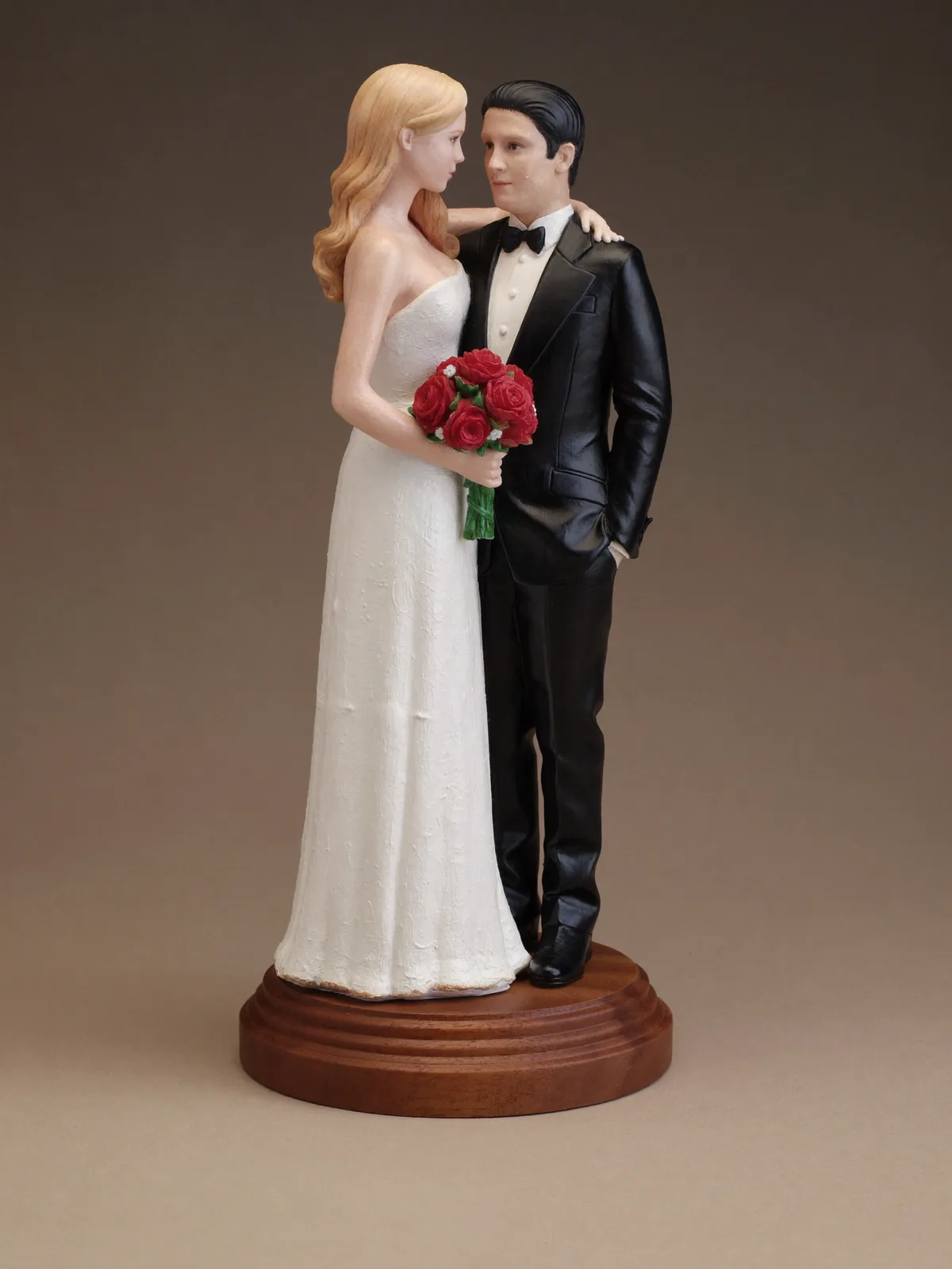 Pair of hand-painted wedding couple sculptures of a bride and groom. Two figures, 5.5″ (14 cm) each, painted to match the real dress